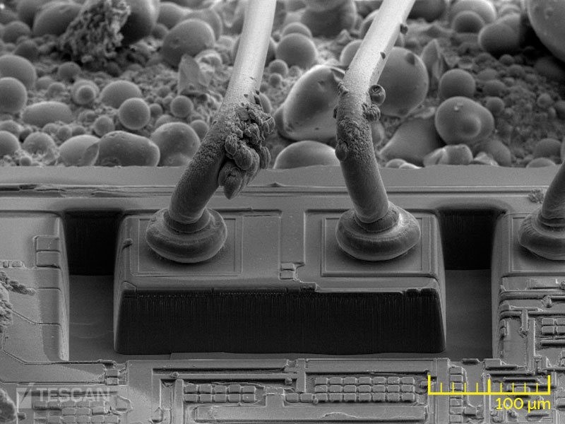 Different cross-sections prepared by Xe plasma FIB: A trench prepared for 3D tomography