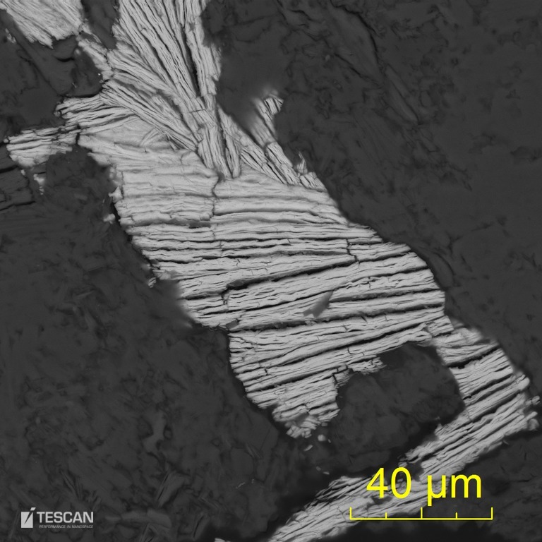 Autunite crystal filling voids in goethite