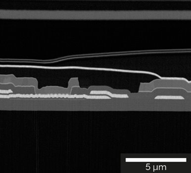 Detailed image of the cross-section of the OLED display showing Al contacts and SiO2/SiNx layer structure imaged with the Mid-Angle BSE detector at 2 keV.