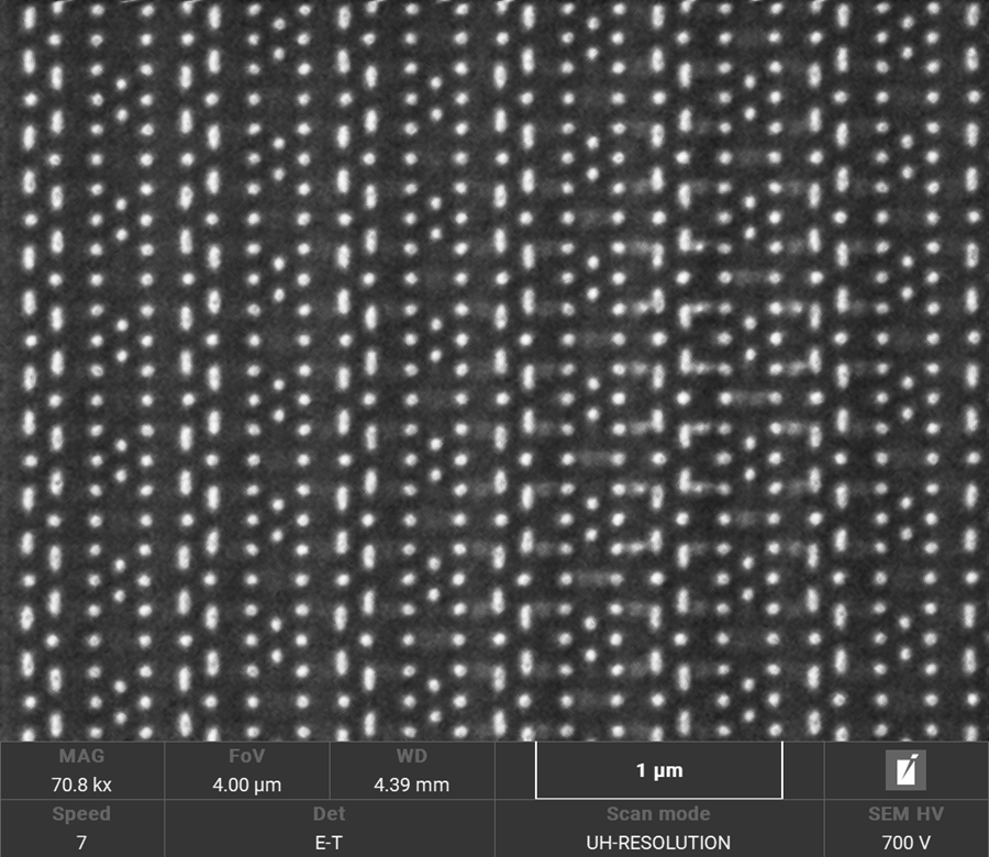 SEM image at 700 eV of an IC delayered to the transistor contact layer. Topography contrast provided by the E-T detector reveals that M1 layer is not fully removed and delayering is not completed.